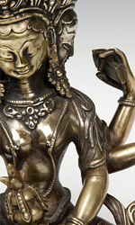 Multiple heads and arms are reflective of a tantric depiction in Buddhist and Hindu art