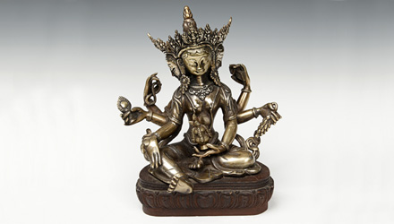 Vasundhara is portrayed sitting on a lotus pedestal