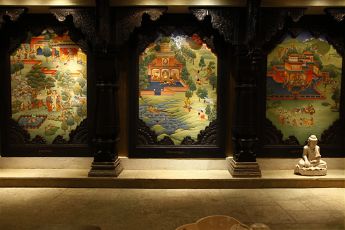 A view of three of the Buddha paintings inside the Buddha Room at Primitive, Chicago