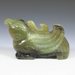 Jade toggle depicting a recumbent Phoenix, or Fenghuang