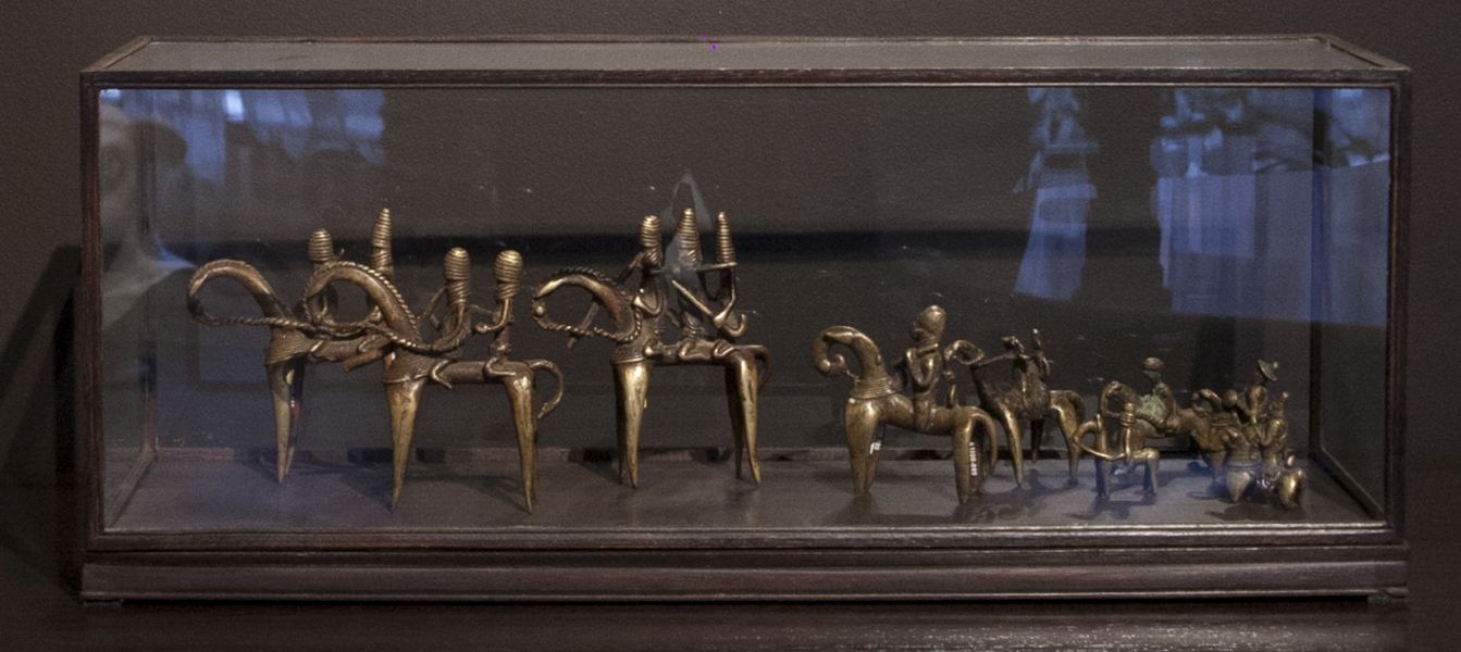 A small collection of miniature bronzes from the Kotoko people in Chad placed in a glass box become exceptionally meaningful when you realize they are amulets designed to cure madness; PRIMITIVE, 3rd Floor Front Showroom; December 2016