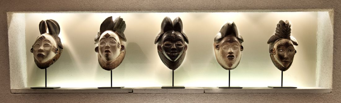 A collection of related African masks on custom iron bases set into an alcove tells a more arresting story than if they were presented separately or hung on a wall; PRIMITIVE, Rear 1st Floor; December 2016