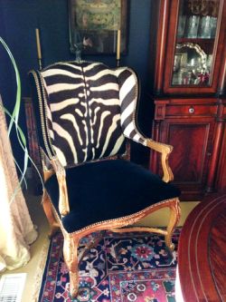 A Ralph Lauren Conservatory Host Hostess Armchair is contemporized with Zebra upholstery to complement and balance a very traditional interior