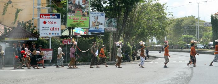 Traffic on Bali stops as a procession makes its way to a temple