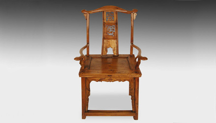 A yoke back armchair with pierced and carved splat