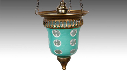 A cold-worked Bohemian goblet repurposed as a light fixture