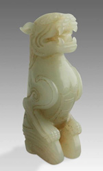 Jade toggle depicting a foo lion