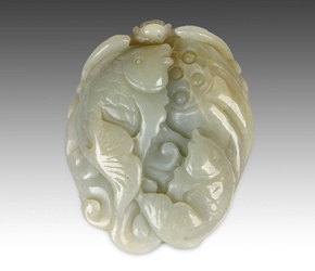 Jade toggle depicting a two fish on lotus pod