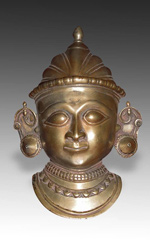 Brass mukha, or face lingam cover depicting Gauri