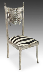 Carved teak wood and silver clad neoclassical style chair from India