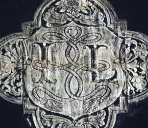 Brass rubbing cartouche with initials I.L.