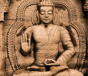 Detail of relief panel depicting the Buddha gesturing the Vitarka mudra