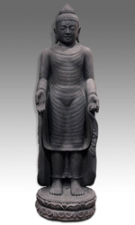 Standing figure of Buddha gesturing the Varada mudra