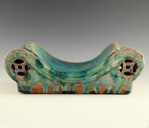 Imagine leaping into bed with this Chinese archaic form pillow â€“ a bit more firm than what we're used to today!