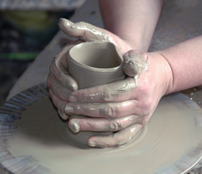 The guest bedroom became a studio, equipped with plastic sheets and a potter's wheel