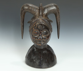 Helmet mask depicting Eshu, known as the 'Guardian of the Crossroads'