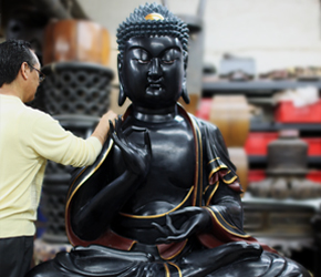 Black Buddha undergoing restoration