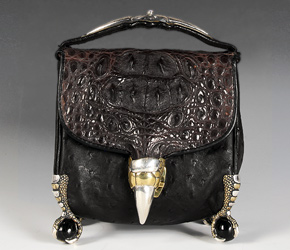 Darling Clutch, composed of crocodile and ostrich hide, gold, silver, horn and opal
