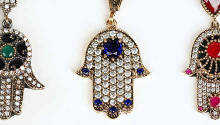 Part of a much larger collection of precious and semi-precious Hamsa pendants