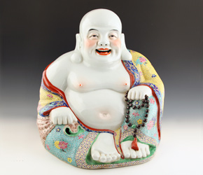 Porcelain seated figure of Budai or Laughing Buddha