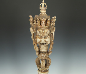 Phurba crowned with deities committed to conquering evil