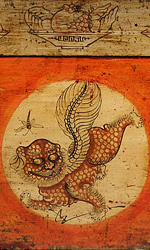 A foo dog and dragonfly steal the spotlight on the front of this antique Chinese opera podium A foo dog and dragonfly steal the spotlight on the front of this antique Chinese opera podium