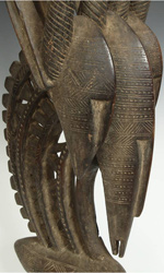 These abstracted antelope forms often depict children on the back - however this pair features an extremely rare three-headed motif These abstracted antelope forms often depict children on the back - however this pair features an extremely rare three-headed motif