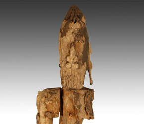 Carved wooden seated figure by the Dogon people