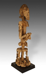 This wooden statue has been repaired multiple times using iron strapping