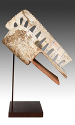 This mask is rubbed white with kaolin and patterned with indigo dye This mask is rubbed white with kaolin and patterned with indigo dye