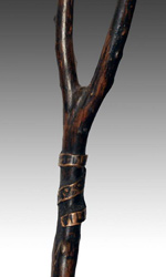 This dula is Y-shaped and wrapped in copper accents This dula is Y-shaped and wrapped in copper accents