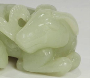 Jade charm depicting adult and child ram