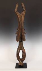 This Osseyba has faces on both the front and back This Osseyba has faces on both the front and back