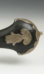 Familiar motifs, like this hamsa, can be seen in the silver accents