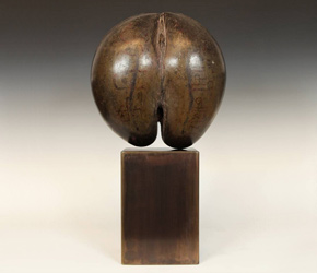 Coco de mer or Seychelles coconut with inscription on patinated steel base