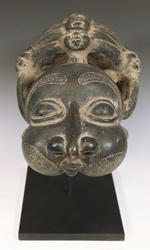 The dramatic size of this pipe symbolizes the power of the fon, or chief