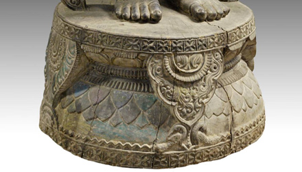 Carved wood figure of Radha on lotus base