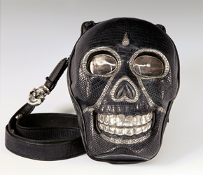 The Skull Bag features an expandable compartment, secure phone pocket and adjustable shoulder strap