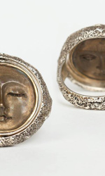 Ring depicts a reversible Sun & Moon motif in bronze and sterling silver