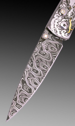 The button lock and thumb stud were set with diamonds