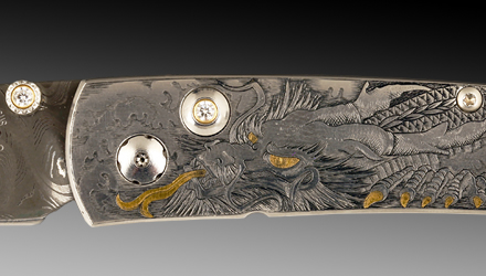 The engraved design on the handle depicts a classical, writhing dragon connecting heaven and earth