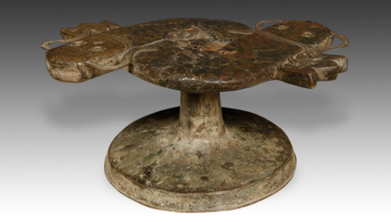An example of a bronze Benin stool with a mudfish motif