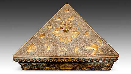 On the face are three central medallions which represent stylized double dorjes, one of the premier symbols in Tibetan Buddhism