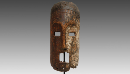 The Bwami masks of the Songola tend to be large and elongated, with geometrically stylized eyes and mouth