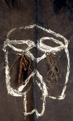 The shield is painted with kaolin, soft white clay and depicts a “taunting” face