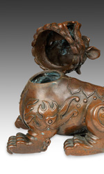 The Foo Dog's head acts as the lid to this bronze incense burner