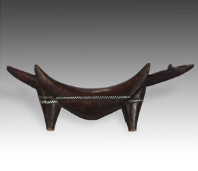 A carved wood headrest by the Dinka people of Sudan, East Africa
